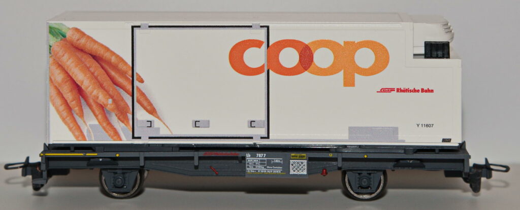 Bild zeigt einen Tragwagen mit einem Container von Coop